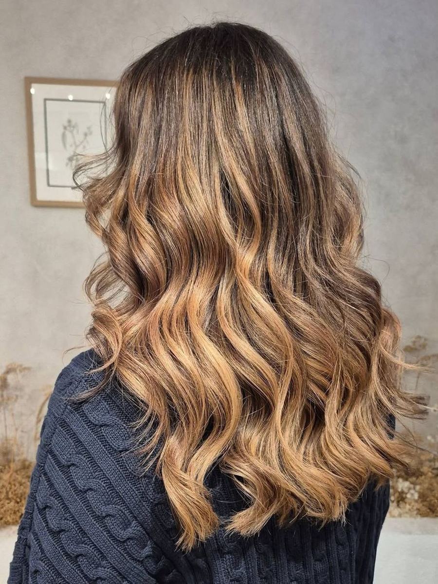 Long, glossy caramel balayage waves